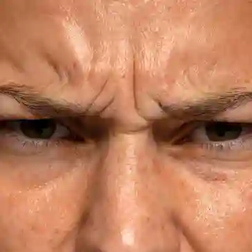 Frowning eyes and forehead with wrinkles.